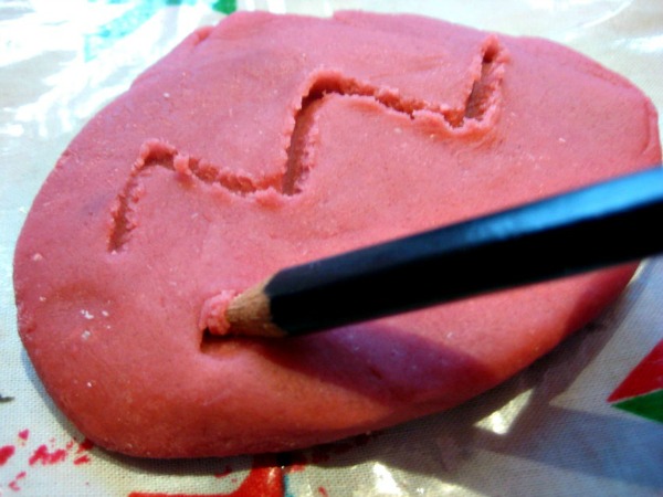 making marks in play dough