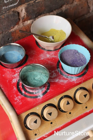 using colored sand in a pretend play kitchen