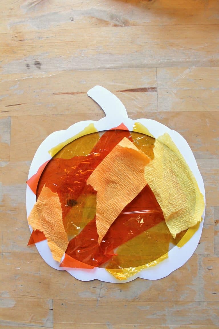 Easy pumpkin suncatcher craft with printable template - NurtureStore