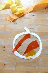 Easy pumpkin suncatcher craft with printable template - NurtureStore