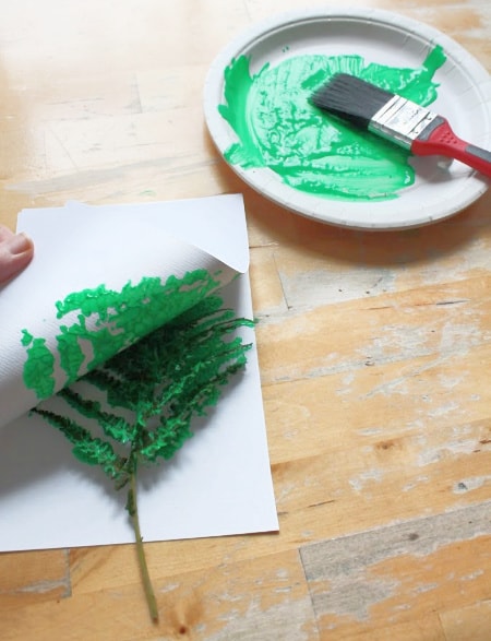 Leaf print Christmas tree craft for forest school - NurtureStore