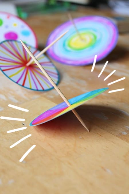 Easy forces science lesson plan with free spinning tops printable